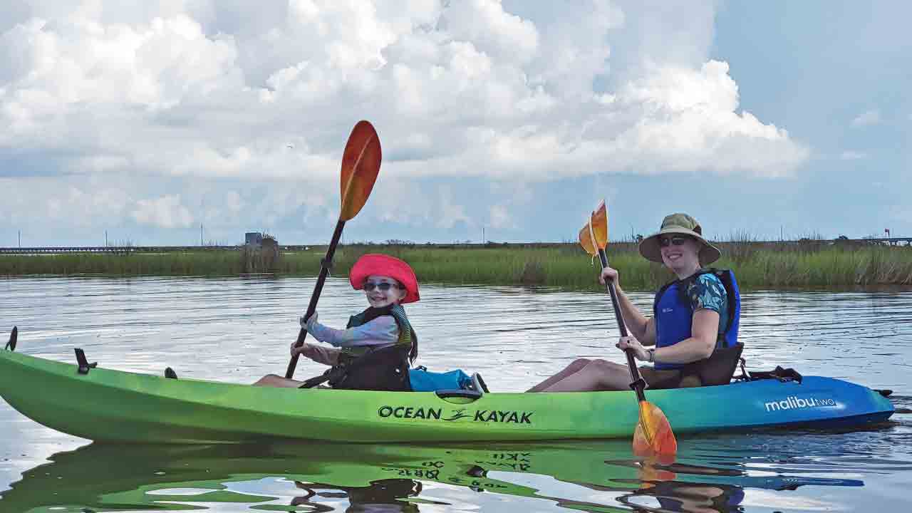 Two people in a kayak during Family Camp.